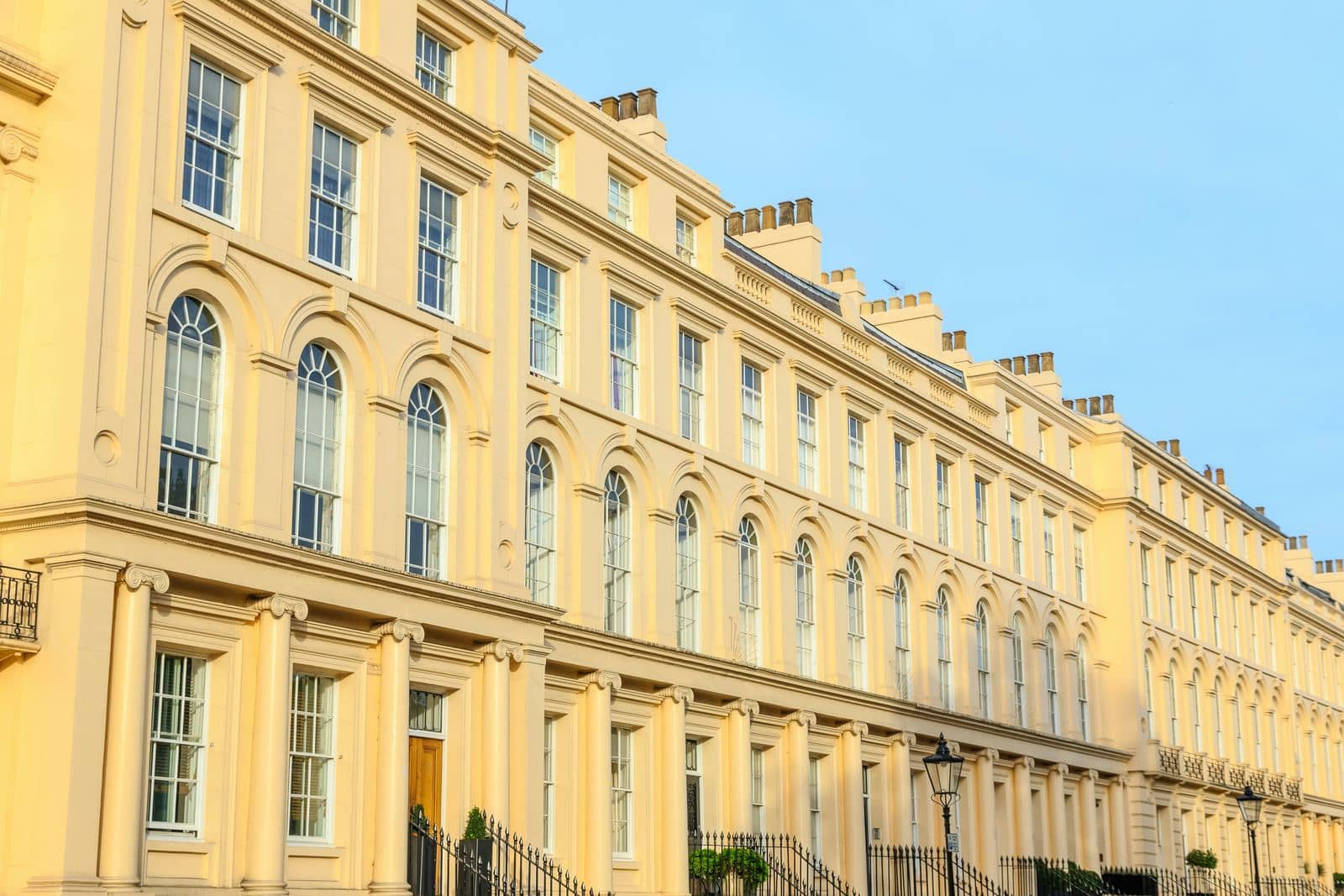 London Regency stuccoed terrace catching late golden-hour light